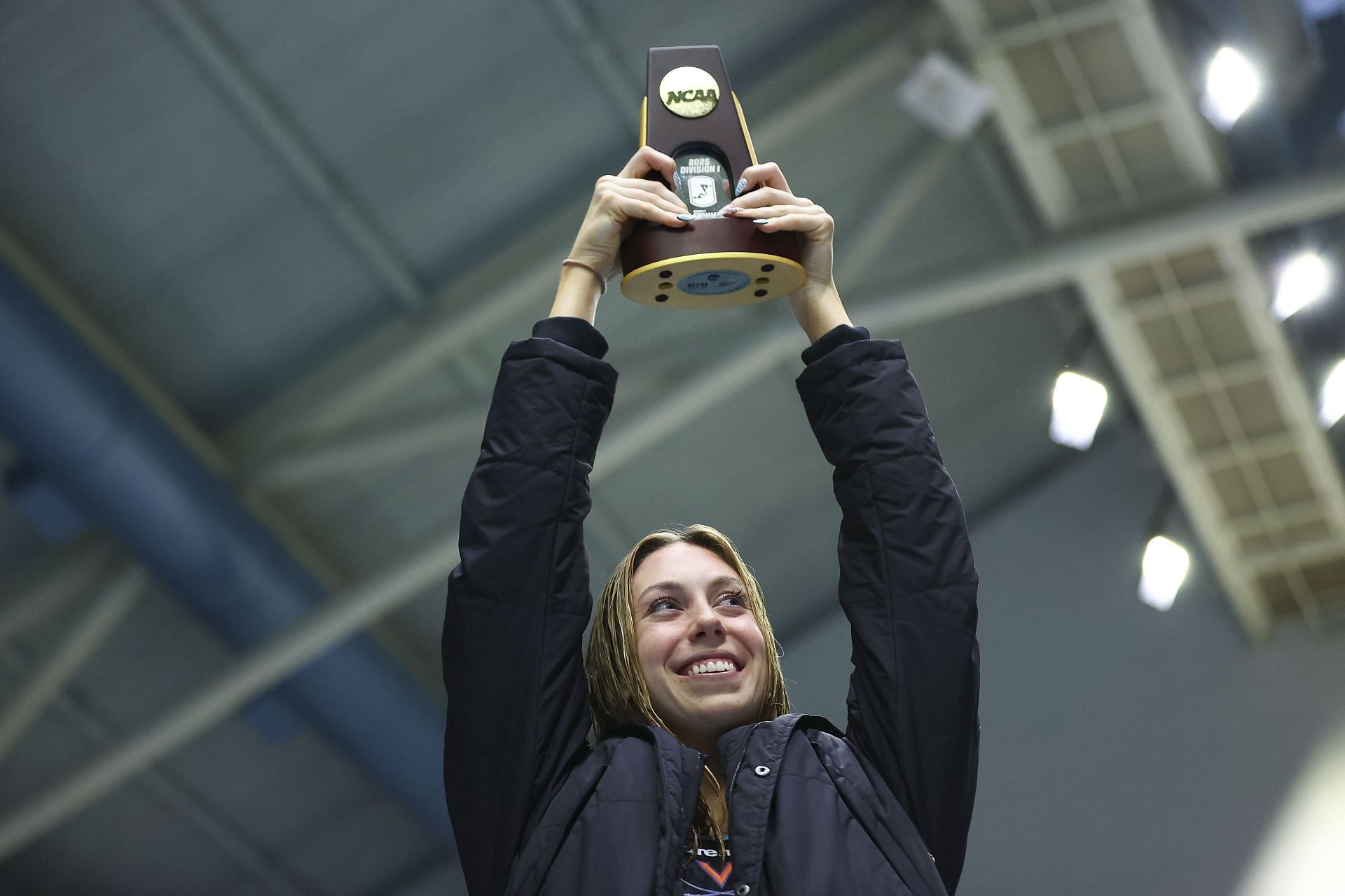 Walsh with her trophy at the 2025 NCAA Division I Women's Swimming and Diving Championships - (Source: Getty)